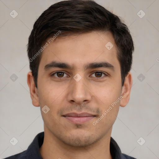 Joyful white young-adult male with short  black hair and brown eyes