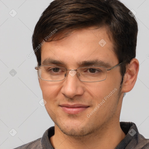 Joyful white adult male with short  brown hair and brown eyes