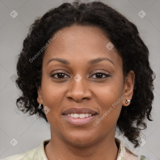 Joyful black young-adult female with medium  brown hair and brown eyes