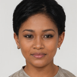 Joyful asian young-adult female with short  black hair and brown eyes