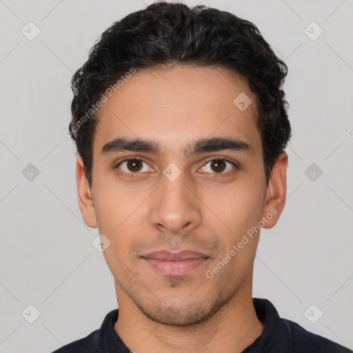 Neutral latino young-adult male with short  black hair and brown eyes