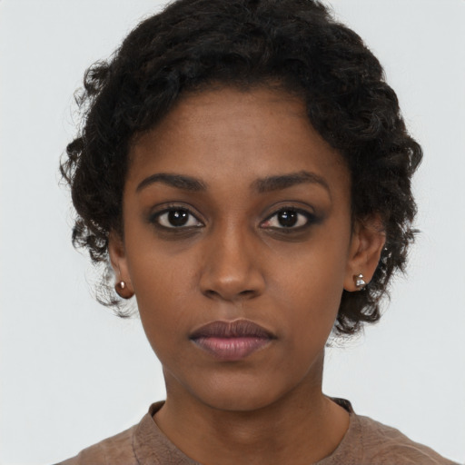 Neutral black young-adult female with short  black hair and brown eyes