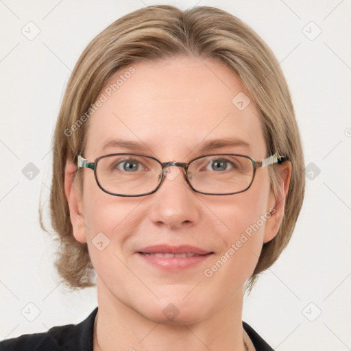 Joyful white adult female with medium  brown hair and blue eyes