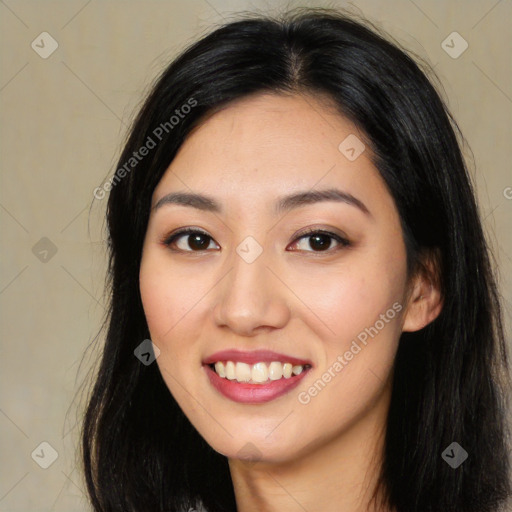 Joyful latino young-adult female with long  black hair and brown eyes