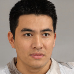 Neutral asian young-adult male with short  brown hair and brown eyes