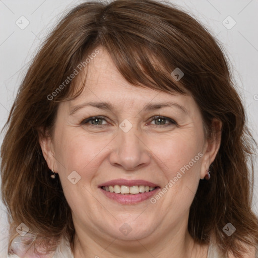 Joyful white adult female with medium  brown hair and brown eyes