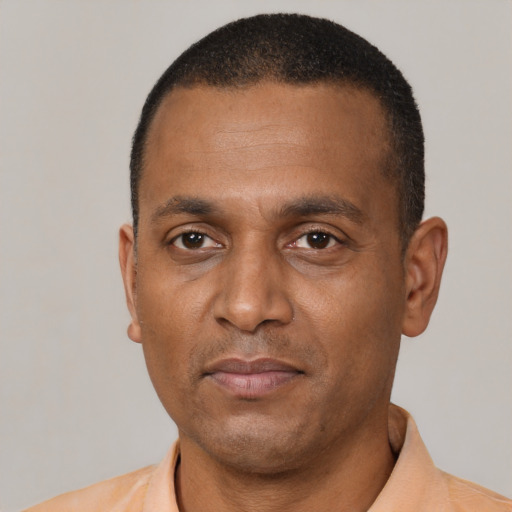 Neutral black adult male with short  brown hair and brown eyes