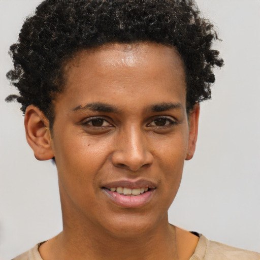 Joyful black young-adult female with short  brown hair and brown eyes