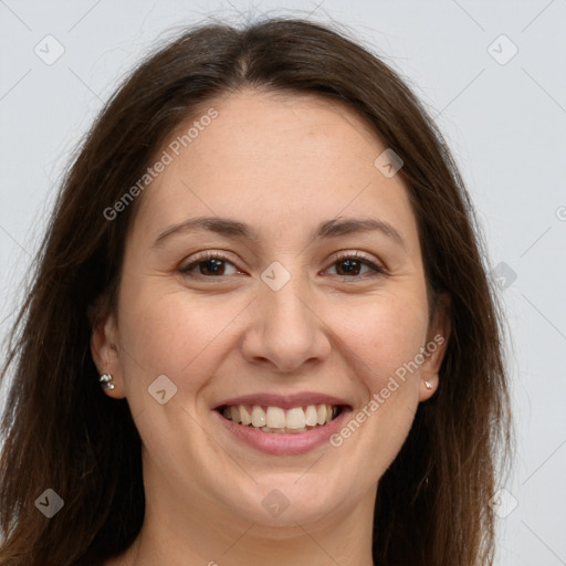 Joyful white young-adult female with long  brown hair and brown eyes