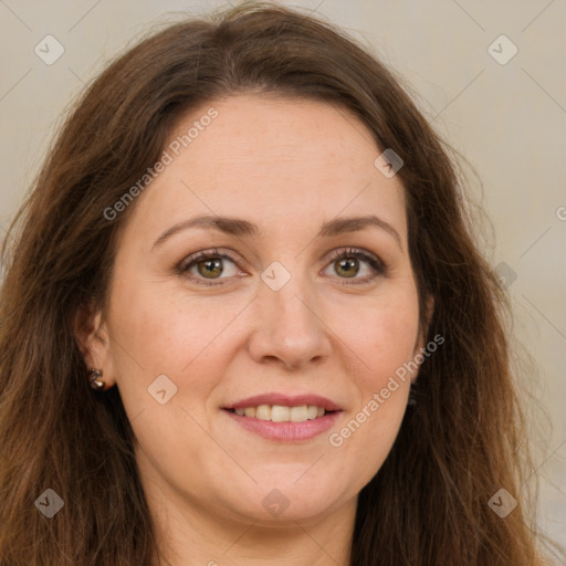 Joyful white adult female with long  brown hair and green eyes