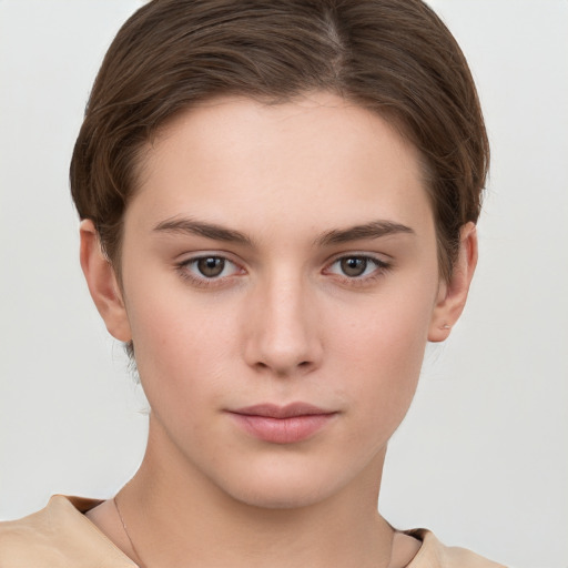 Neutral white young-adult female with short  brown hair and brown eyes