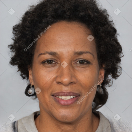 Joyful black adult female with short  brown hair and brown eyes