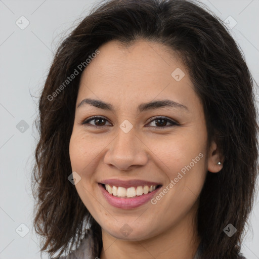 Joyful white young-adult female with long  brown hair and brown eyes