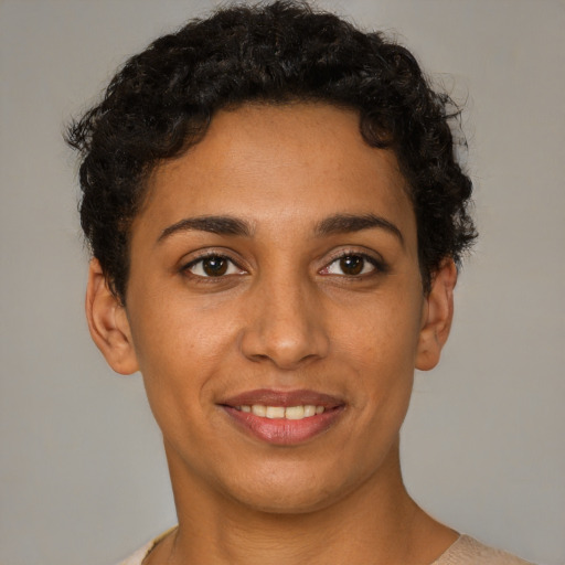 Joyful white young-adult female with short  brown hair and brown eyes