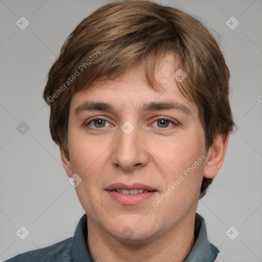 Joyful white adult male with short  brown hair and grey eyes