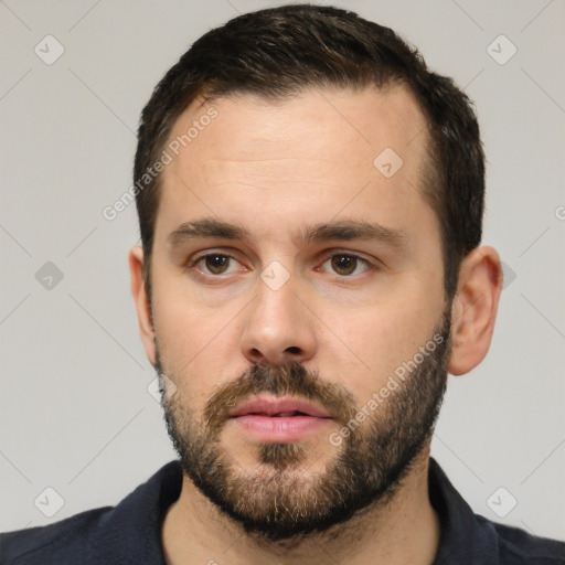 Neutral white young-adult male with short  black hair and brown eyes