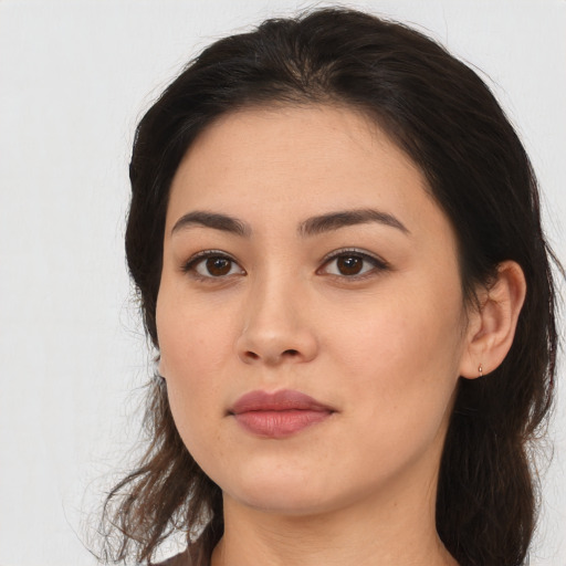 Neutral latino young-adult female with long  brown hair and brown eyes