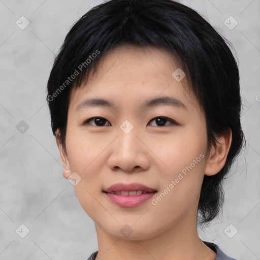 Joyful asian young-adult female with medium  black hair and brown eyes