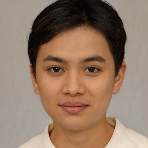 Joyful asian young-adult female with short  black hair and brown eyes