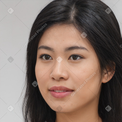 Joyful latino young-adult female with long  brown hair and brown eyes