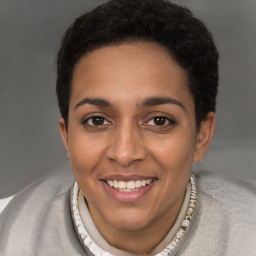 Joyful latino young-adult female with short  brown hair and brown eyes