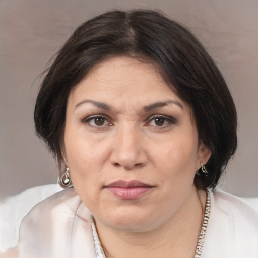 Joyful white adult female with medium  brown hair and brown eyes