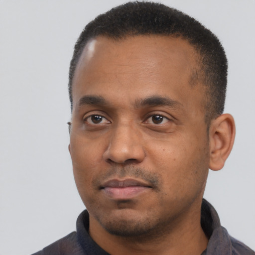 Neutral black young-adult male with short  black hair and brown eyes