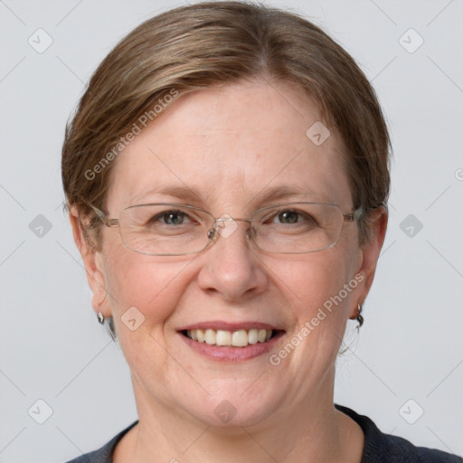 Joyful white adult female with short  brown hair and grey eyes