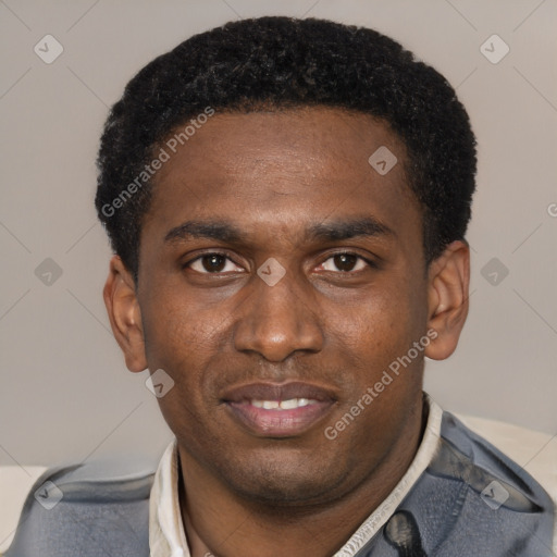 Joyful black young-adult male with short  black hair and brown eyes
