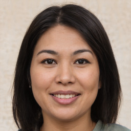 Joyful asian young-adult female with medium  brown hair and brown eyes