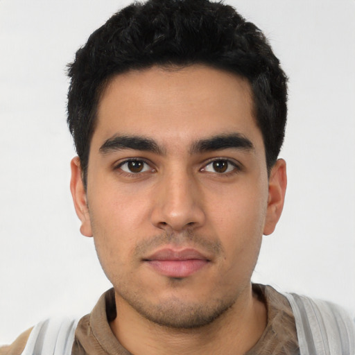 Neutral latino young-adult male with short  black hair and brown eyes