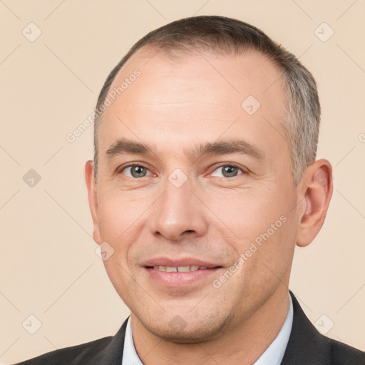 Joyful white adult male with short  brown hair and brown eyes