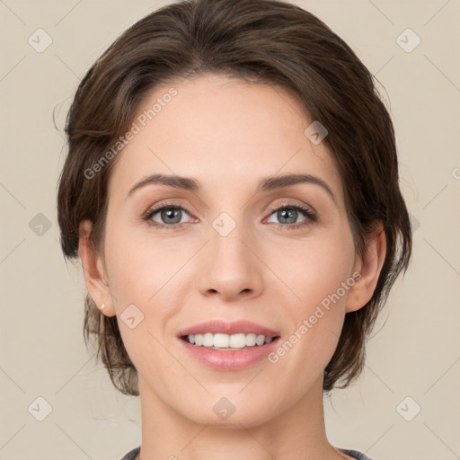 Joyful white young-adult female with medium  brown hair and green eyes