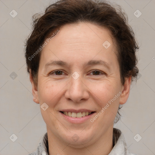 Joyful white adult female with short  brown hair and brown eyes