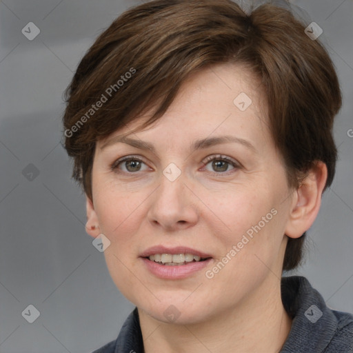 Joyful white adult female with medium  brown hair and grey eyes