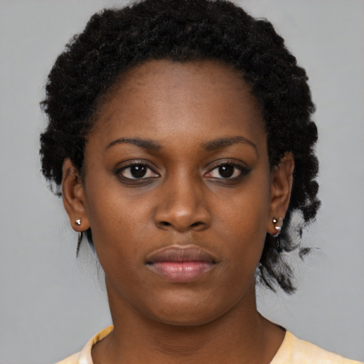 Neutral black young-adult female with medium  black hair and brown eyes