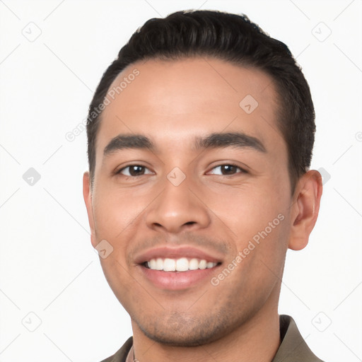 Joyful white young-adult male with short  black hair and brown eyes