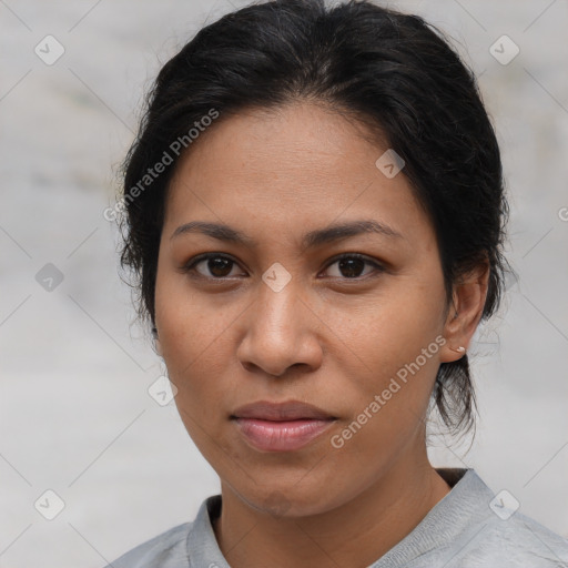 Joyful asian adult female with medium  brown hair and brown eyes