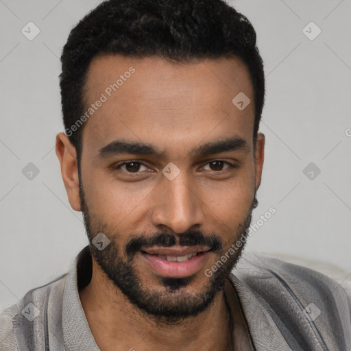 Joyful black young-adult male with short  black hair and brown eyes