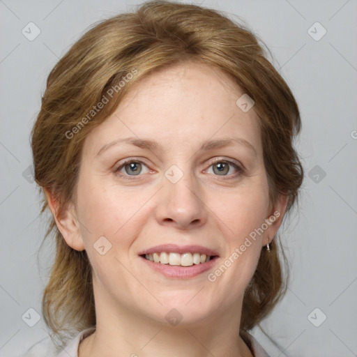 Joyful white young-adult female with medium  brown hair and blue eyes