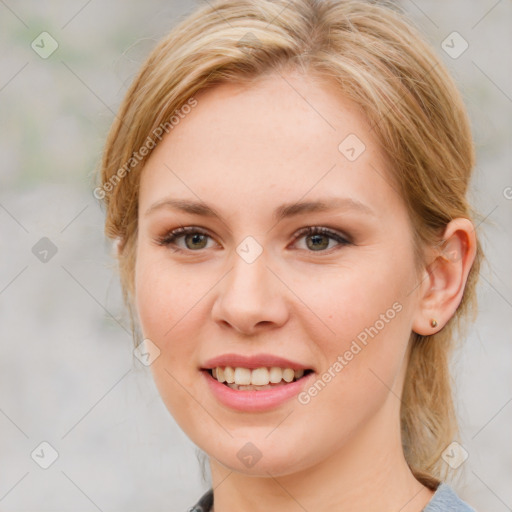 Joyful white young-adult female with medium  brown hair and blue eyes