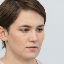 Neutral white young-adult female with short  brown hair and brown eyes