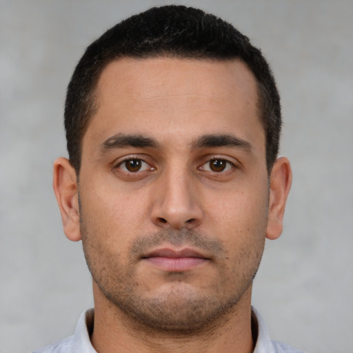 Neutral white young-adult male with short  brown hair and brown eyes