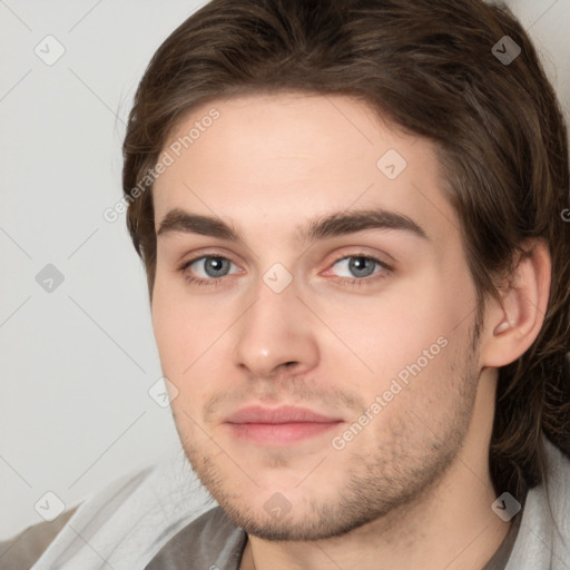 Joyful white young-adult male with medium  brown hair and brown eyes