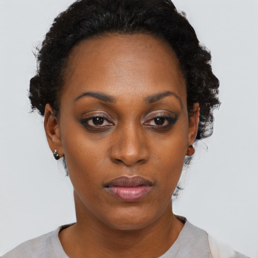 Neutral black adult female with short  black hair and brown eyes