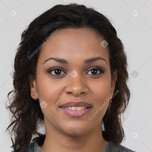 Joyful black young-adult female with long  brown hair and brown eyes