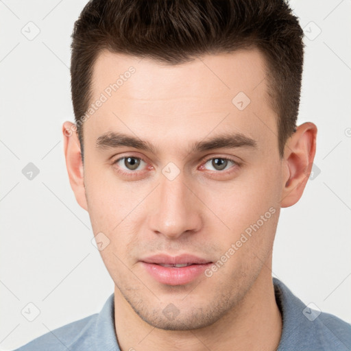 Neutral white young-adult male with short  brown hair and brown eyes