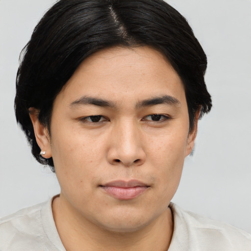 Joyful asian young-adult male with short  brown hair and brown eyes
