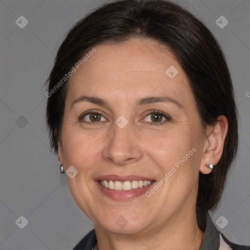 Joyful white adult female with medium  brown hair and brown eyes