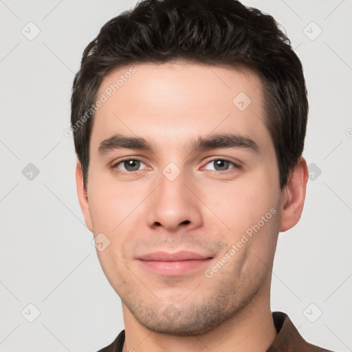 Joyful white young-adult male with short  black hair and brown eyes